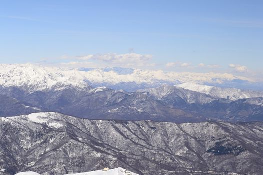 Candid off-piste ski slope in scenic background of high mountain peak