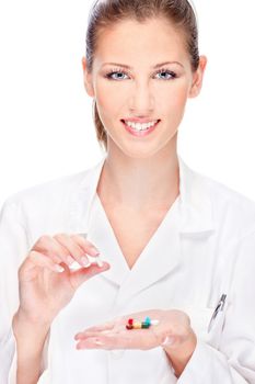 Pretty female nurse holding  medicals, isolated on white