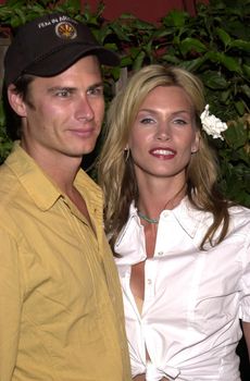 Natasha Henstridge and Liam Waite at the launch party for Eastwood Ranch's new lifestyle brand with "Denim Tapas and Tequila" held at Chadwick, Beverly Hills, CA 07-16-02