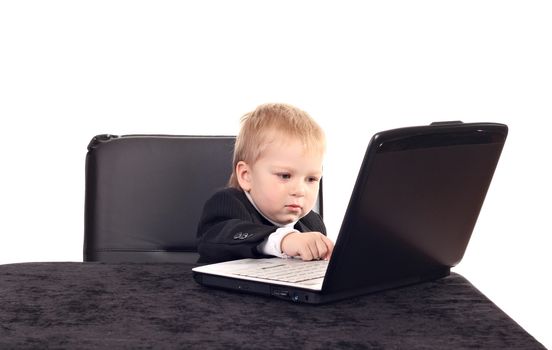 Little businessman working with computer