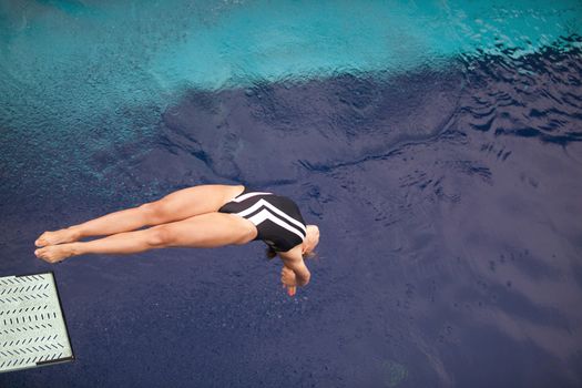 Girl diving into the pool