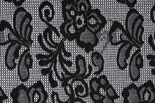 Grey flowers on a black and white textile background