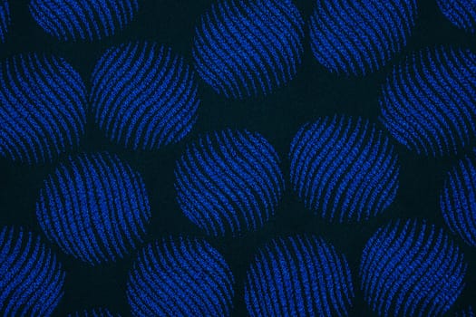 Material in the blue circles, a navy-blue textile background
