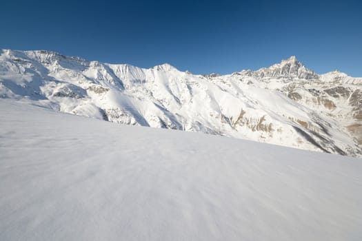 Winter mountainscape and superb frontal view on the majestic M. Viso (3841 m), Po Valley, Piedmont