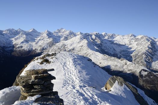 Majestic view of Gran Paradiso peak (4061 m) and high altitude range from the top of a nearby mountain