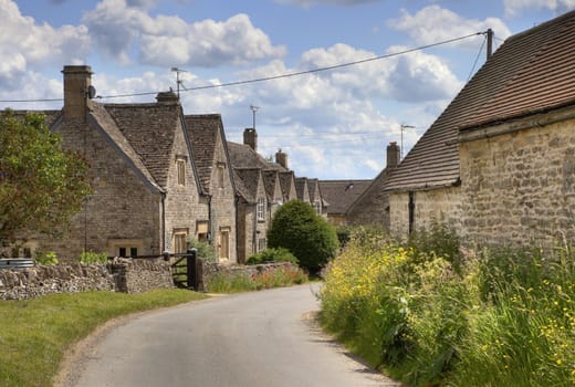 Pretty stone cottages in the village of Hazelton, Gloucestershire, England.