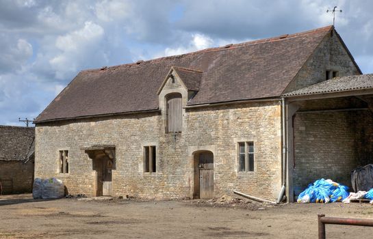 Old, high-status farm barn, Cotswolds, Gloucestershire, England.