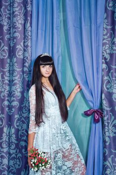 Attractive young girl with gorgeous bouquet of flowers shot in studio