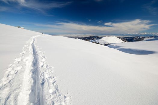 Ski touring (back country skiing) in majestic high mountain scenery, italian Alps