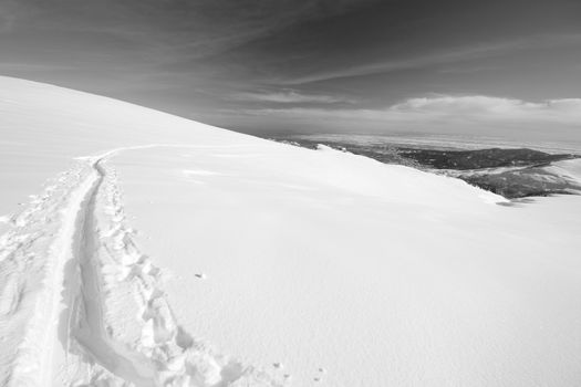 Ski touring (back country skiing) in majestic high mountain scenery, italian Alps