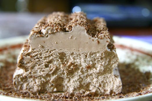 Chocolate ice cream and hardered chocolate over