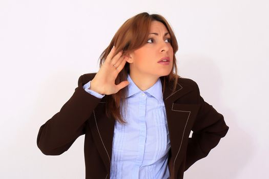 portrait of business woman with hand on ear