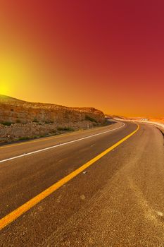 Asphalt Road in the Judean Desert on the West Bank, Sunset 