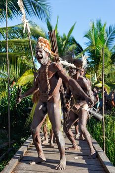 JOW VILLAGE, ASMAT, NEW GUINEA, INDONESIA -JUNE 28:The Village follows the ancestors embodied in spirit mask as they tour the village the Doroe ceremony. June28, 2012 in Jow Village, Asmat, Indonesia 