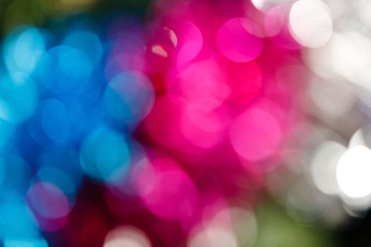 Abstract christmas background. Holiday colored lights unfocused