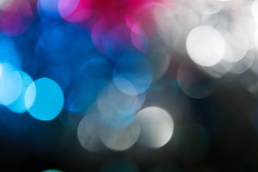 Abstract christmas background. Holiday colored lights unfocused