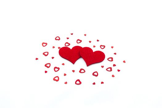 Big and small heart decorations on white background