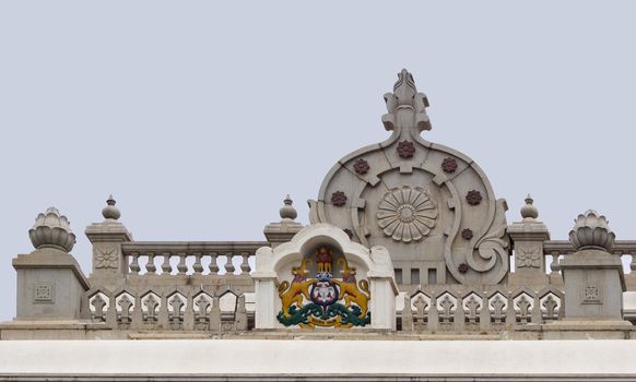 Coat of Arms of Karnataka State stands on top of the parliament building in Bangalore.