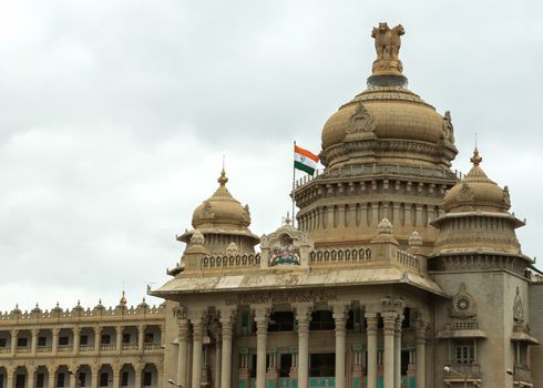 Ashoka Chakra, Indian flag, State Coat of Arms and State's slogan all on top of the main entrance to the Vidhana Sabha in Bangalore.