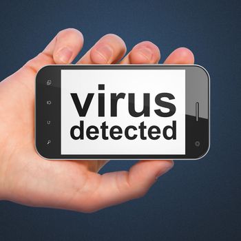 Safety concept: hand holding smartphone with word Virus Detected on display. Mobile smart phone on Blue background, 3d render