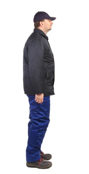 Worker in winter workwear. Side view. Isolated on a white background.