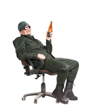 Worker in glasses sitting with beer. Isolated on a white background.
