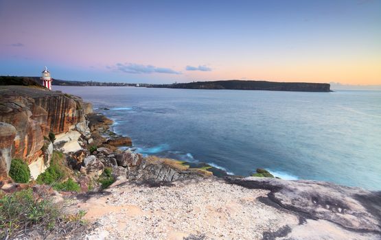 This wide angle  shot captures South Head, North Head and Middle Head at dawn, just before sunrise.  This is the entrance to Sydney Harbour