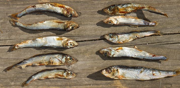 Plenty of small dried fishes on a stack