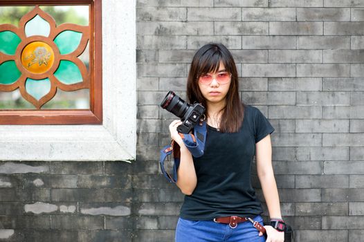 Fashion of a girl wearing a striped holding the camera