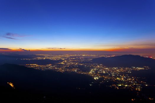 City lights at night along mountains in Hong Kong