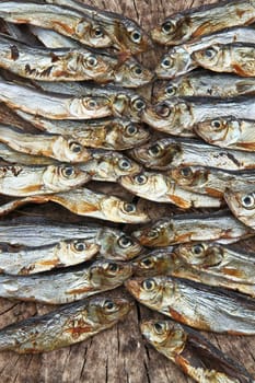 Plenty of small dried fishes on a stack