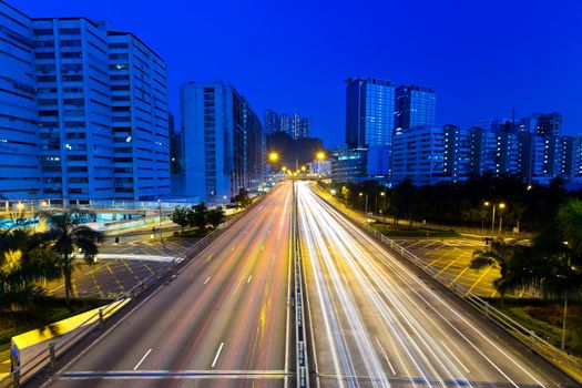 Moving cars on highway at night