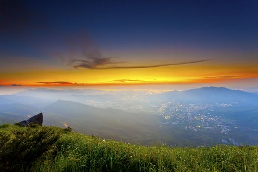 Sunset mountains with moody clouds