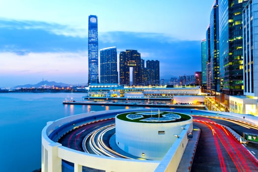 Moving light trails with modern buildings background