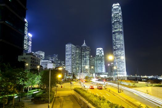 Hong Kong traffic and skyscraper offices at night