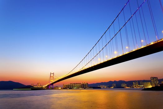 Modern bridge connecting the city at sunset