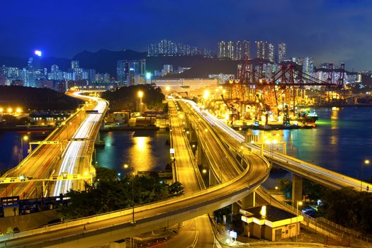 Cargo terminal traffic in city at night