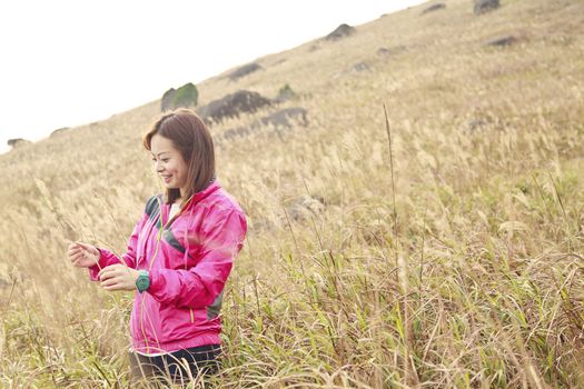 Chinese young asia woman in grasses