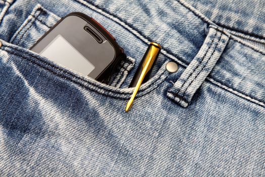 Blue jeans pocket with phone and pen