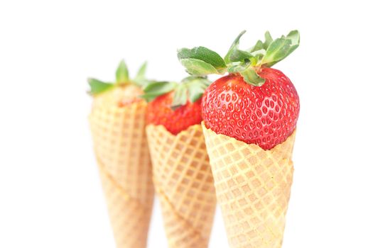 strawberry in a waffle cone isolated on white