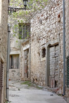 Retro image of an old narrow passage