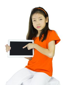 Asian Young girl is showing tablet while sitting at table, isolated over white