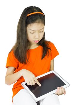 Asian Young girl is using tablet while sitting at table, isolated over white