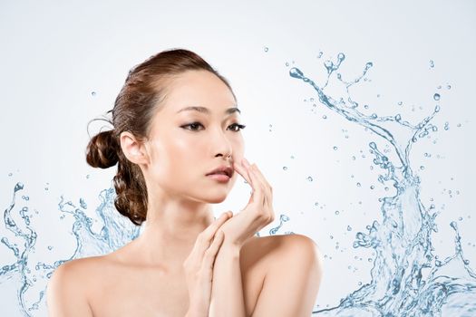 Asian beauty face with water, closeup portrait with clean and fresh elegant lady.