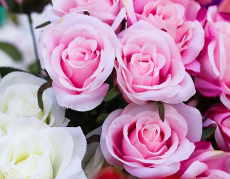 Pink fabric roses,Fake textile pink roses close-up floral background