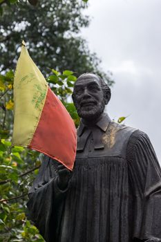 Statue of Reverend Dr. Ferdinand Kittel stands in his own little park in Bengaluru. The yellow and red flag is a symbol of Karnataka. Dr. Kittel made the first dictionary English-Kannada.