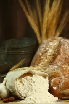 Fresh Baked Bread on Wooden Background