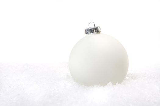 Holiday Christmas Ornament in Snow With Copy Space