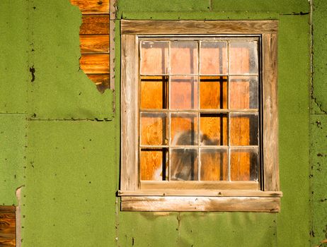 A structure photographed from the outsdie has been boarded up from the inside