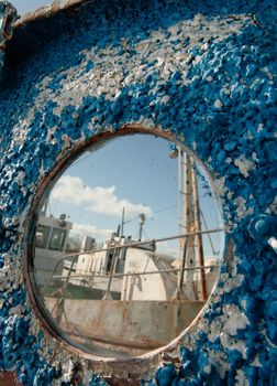 Frozen porthole on the old ships 